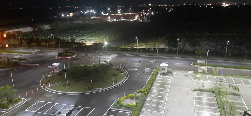 a parking lot with a parking lot and a lot of parking spaces