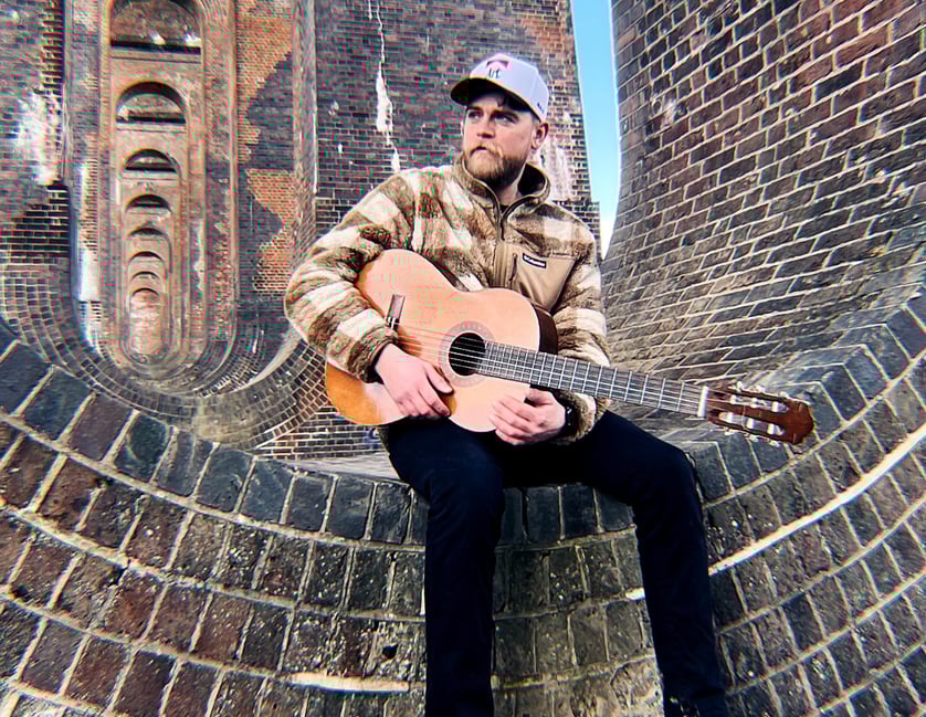 a man with a guitar and a guitar