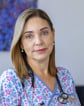 a woman in a floral print scrubsuit