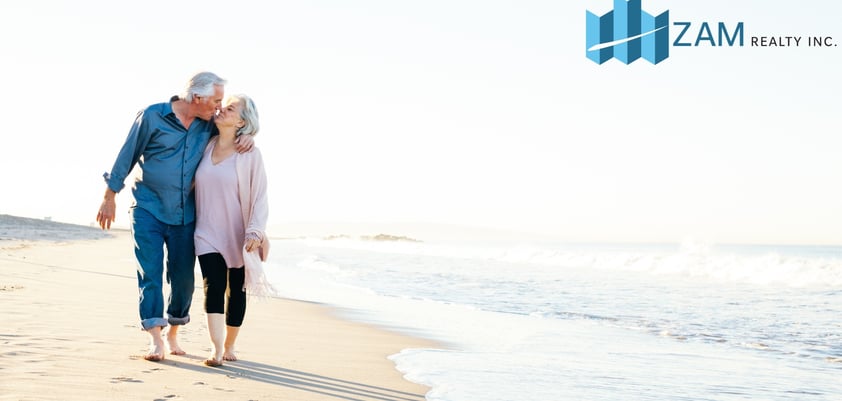 Retired couple enjoying a walk on a white sand beach in Zambales, promoting a peaceful retirement li