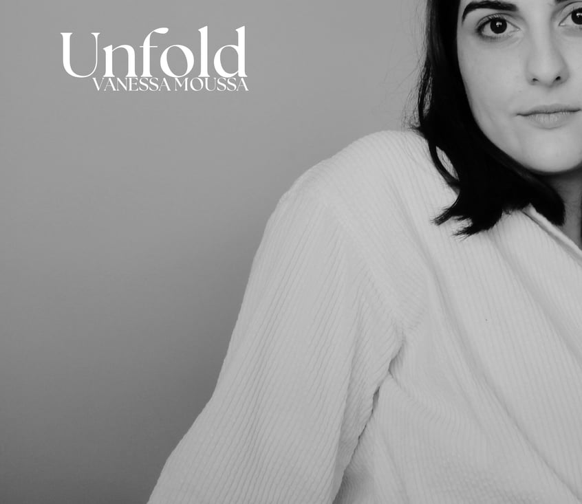 a woman in a robe is holding a tie