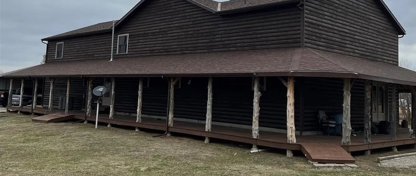 a large house with a brown roof and a brown roof