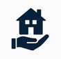 A hand holding a house