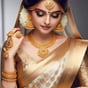 a woman in a gold and white sari