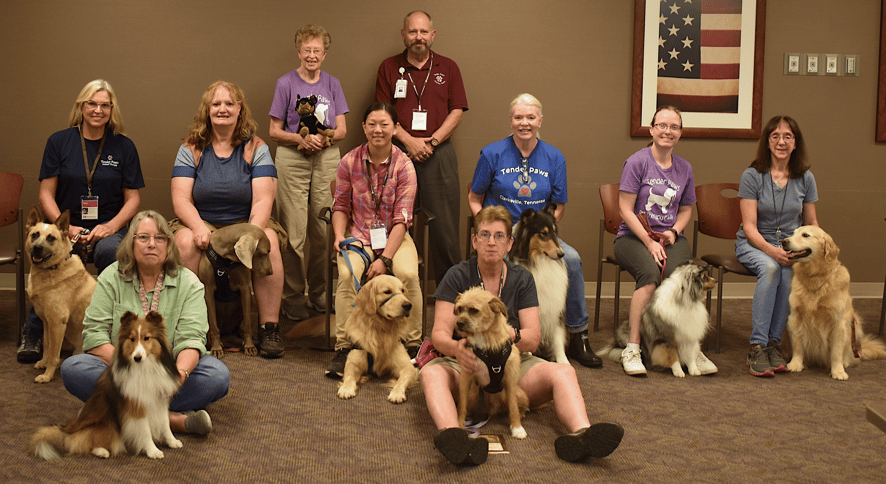 Members of Tender Paws pose for a photo with their Therapy Animals after the meeting on 4 August 202