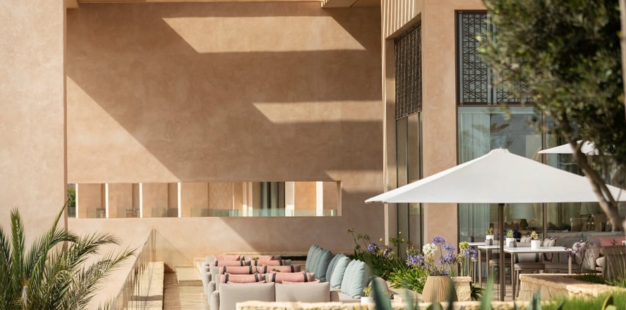Interior of Fairmont Taghazout Bay featuring large-scale mural commissioned from Lumai Studio