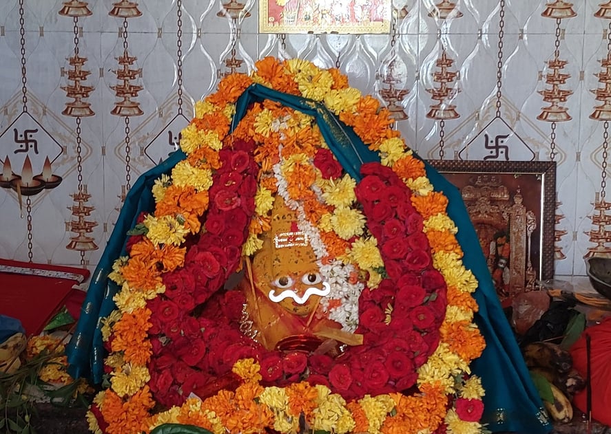 a statue of a woman in a flowered dress