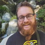 a man with a beard and glasses