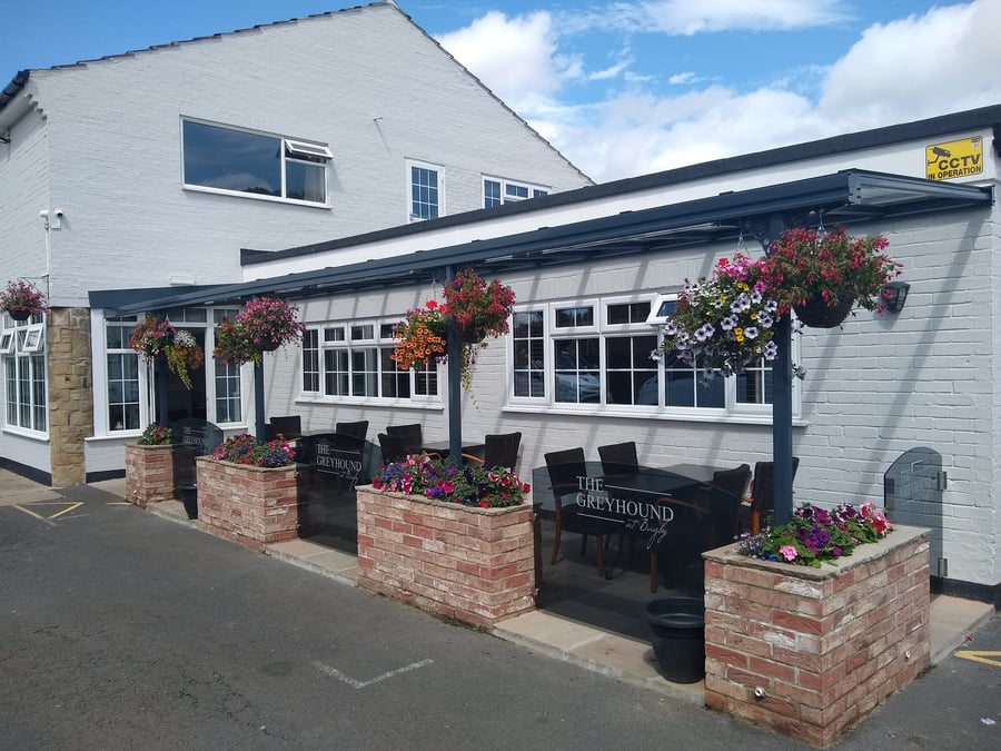 Harbour carport on brick home