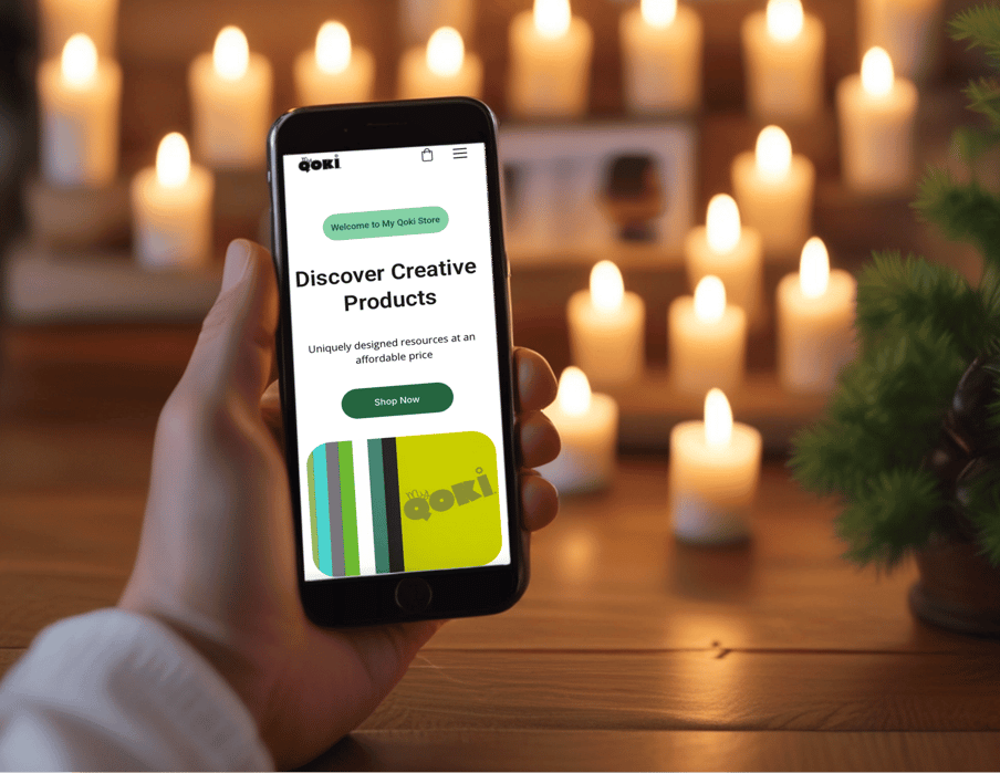 person holding cell phone in front of candles
