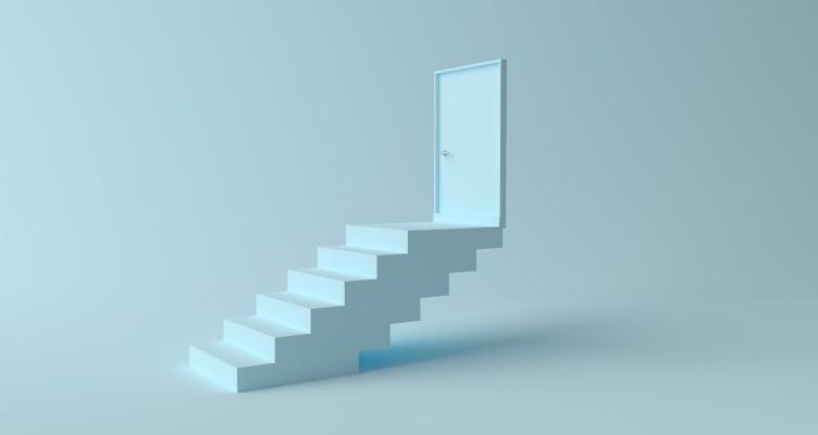 a white staircase leading to a door in air