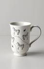 white ceramic mug for writing with elegant horse and bird designs in black. From Joyvity.
