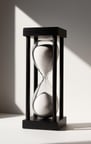 hourglass for writing. white sand and black wooden structure. from Joyvity.