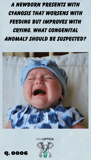 an infant crying with red cheeks and closed eyes