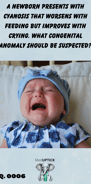 an infant crying with red cheeks and closed eyes