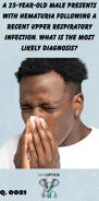 a young African American male blowing his nose