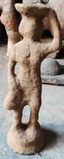 "Special clay layered over wax model in the Dhokra brass art process by tribal artisans of Bastar, Chhattisgarh"