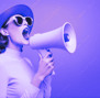 a woman in a hat and sunglasses is holding a megaphone