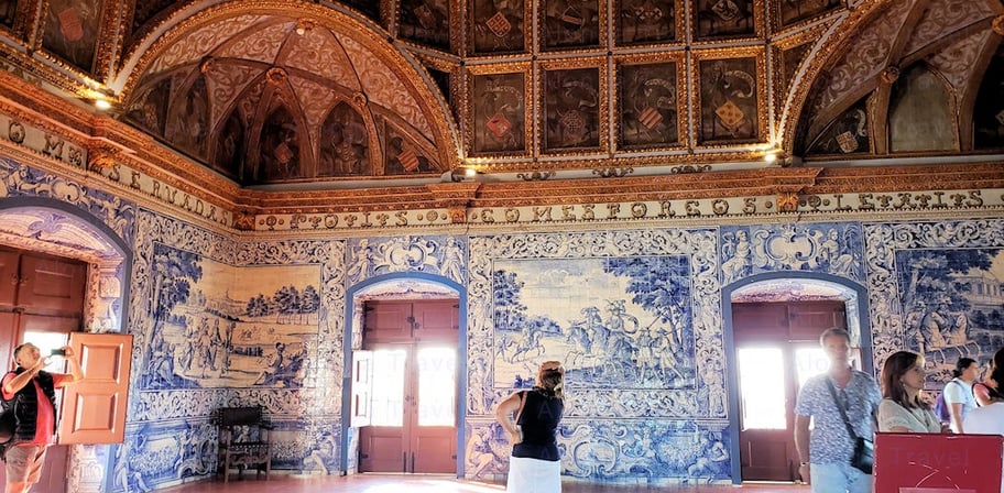 blue ceramic tiles showing hunting scenes in the Heraldic room of Sintra National Palace