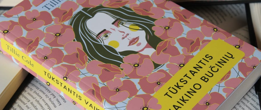 a book with a pink cover and a book with a picture of a woman '