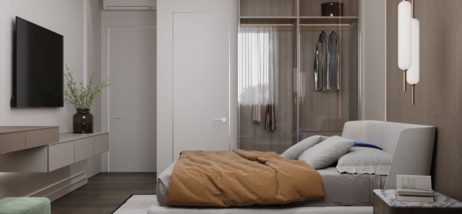a bedroom with a bed and a television
