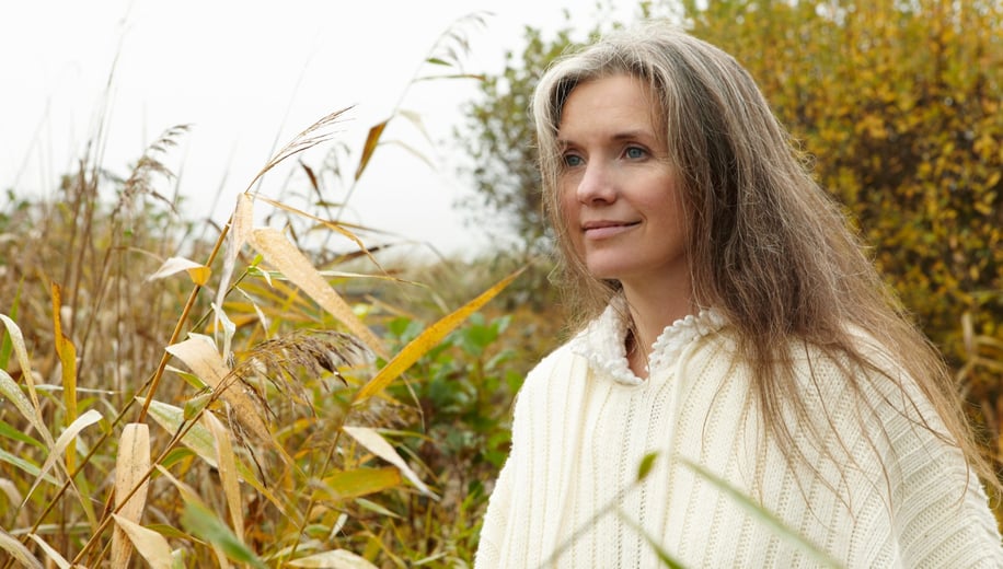 a woman in a white sweater and a white sweater