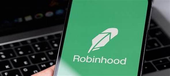 a person holding a phone with a robinhood logo on it
