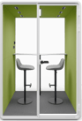 Type T-01: Two-person pod with high stools and a bar-height table, green interior walls