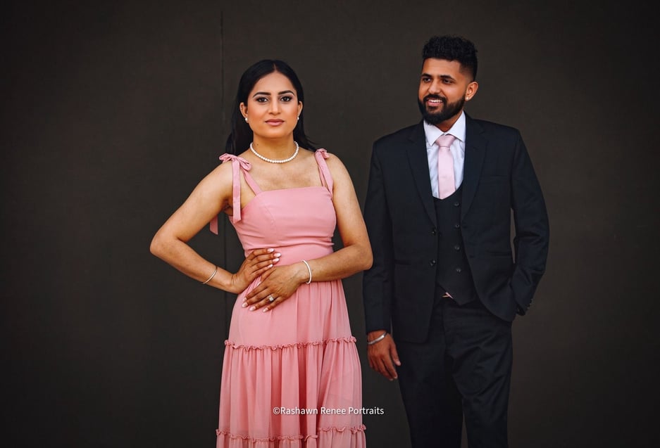 a man and woman standing next to each other