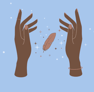 two hands holding a feather 