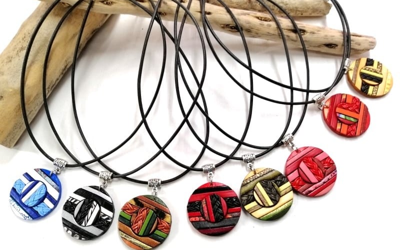 a bunch of necklaces with different designs