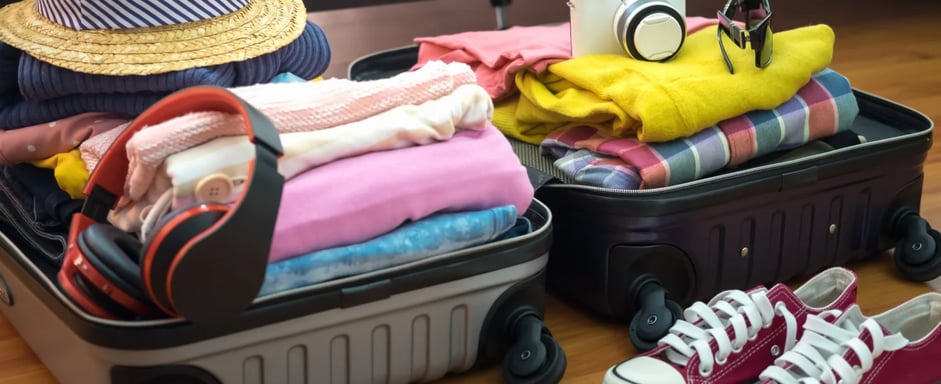 a suitcase with a hat and a hat on it