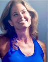 a woman in a blue tank top and a white shirt