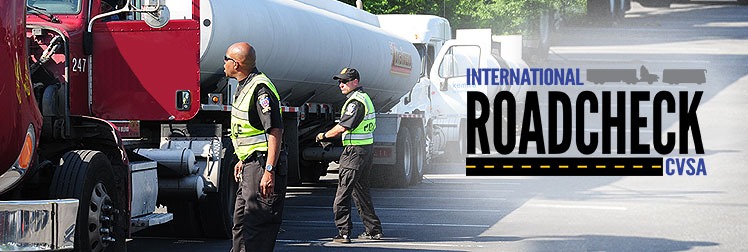 police dot officers inspecting truck