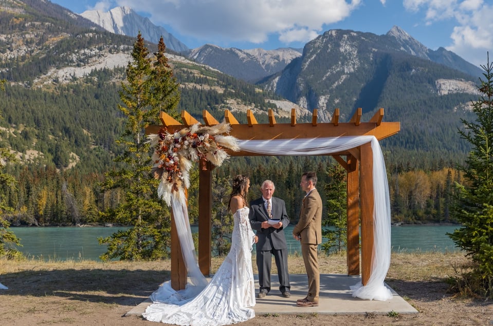 wedding ceremony in front of mountains in Jasper