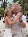 a man and woman dancing at a wedding