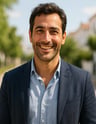 a man in a suit and a blue shirt