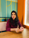 a gorgeous lady sitting in a cafe