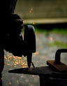 a man is grinding a piece of metal with sparks