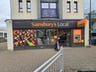 a store front of a store with a sign that says sainsburys local Kempock Street in Gourock