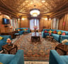 a living room with a couch and a rug in houseboat