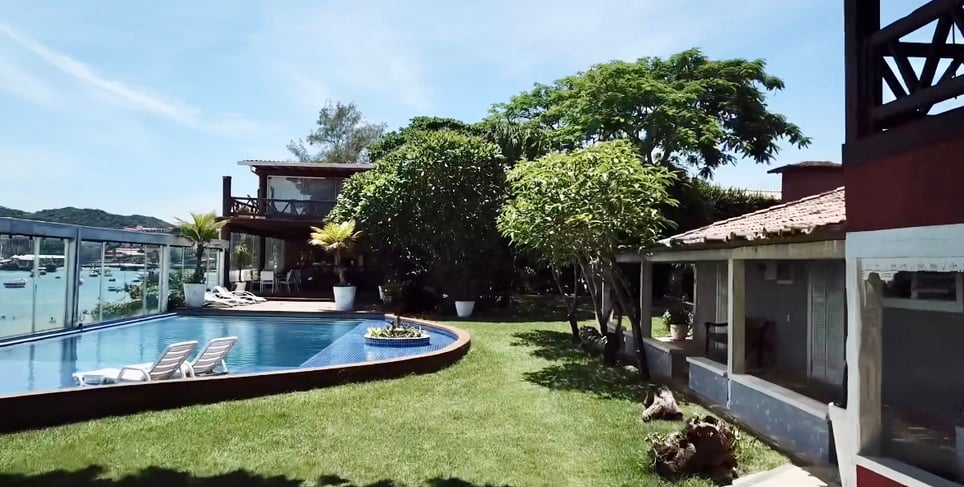 a pool with a boat in the background