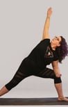 rachel in yoga pose, black outfit purple hair white background