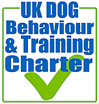 green tick mark logo for the UK dog behaviour and training charter