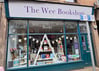 a store front window of a book store on Kempock Street in Gourock