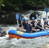 Family enjoying kid-friendly rafting adventure on Ayung River, Ubud, Bali