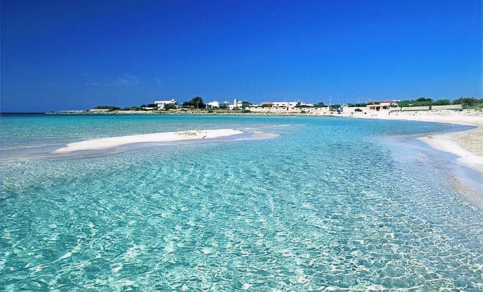 "Punta Prosciutto, Puglia—pristine white sand beach with crystal-clear Ionian waters,