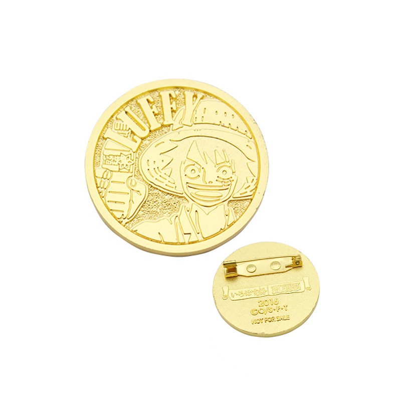 Die struck pin with antique metal-only finish
