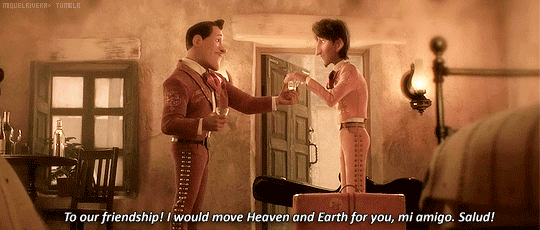 two men standing in a room