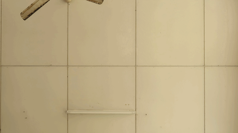 an abstract photo of a curved building with a blue sky in the background